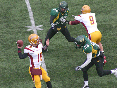 FSU quarterback Robert Banaszak attempts to pass in Saturday's game (Photo by Sandy Gholston)