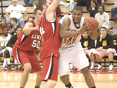 FSU's Justin Keenan drives to the basket versus Lewis (Photo by Ed Hyde, FSU Photo Services)
