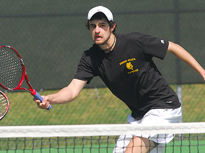 Steven Roberts eyes the ball in Sunday's number one doubles match (Photo by Rob Bentley)