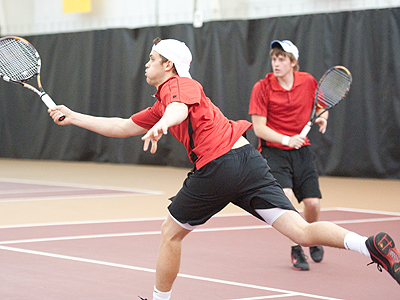 FSU's Justin Hermes (foreground) was a winner in singles play at Northwood