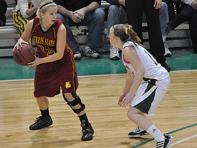 FSU's Sarah DeShone protects the ball in Sunday's game at Northern Michigan (Photo by Rob Bentley)