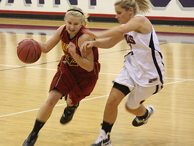 FSU's Sarah DeShone drives with the ball in Wednesday's victory at St. Joseph's (Photo Courtesy Fr. Tim McFarland CPPS)