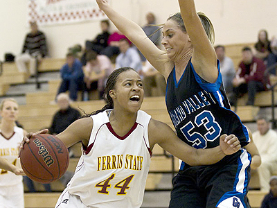 Ferris senior Tiara Adams tries to power her way to the basket against GVSU (Photo by Ben Amato)
