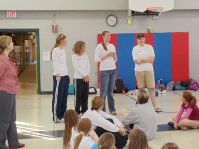 Ferris State women's golf team members Jacqueline DeBoer, Emily Rohdy, Bryce Hetchler, and Cooper Shawen  attend one of the Girls on the Run events at Brookside Elementary School.