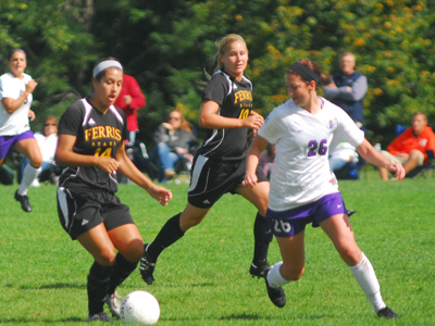 Logan DeClercq (#14) and Bri Borgman (#10) battle a Winona State player for ball possession in Sunday's action.