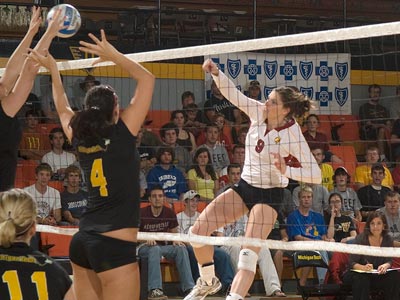 Sarah Lark drives the ball over the net in Friday's match at Michigan Tech. (Photo courtesy of MTU Photo Services)
